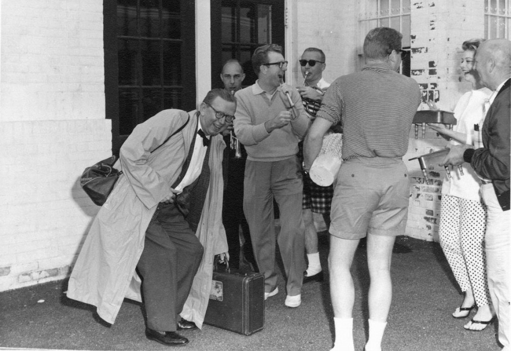Cy arriving in Cape Cod, Massachusetts to a parade of friends with toy instruments